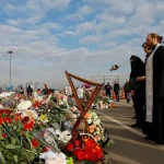 Russia Clergymen conduct a memorial service Crocus City Hall