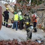 George_collapsed building_rescue workers