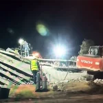 Survivor recounts moment he emerged from deadly South African building collapse George_rescue workers_collapsed building