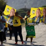 Supporters of the ANC hold placards_Port St Johns_EC