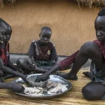Children share a meal