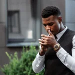 Person smoking cigarette_pexels-thirdman-5061272