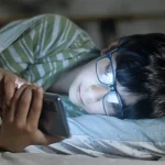 youngster browsing on mobile phone