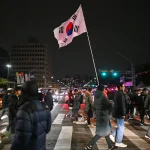 man holds South Korean flag