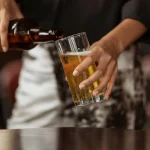 South Africa wants to make alcohol more expensive. Why it’s a good idea – health economist pouring beer_pexels-ketut-subiyanto