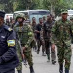 DRC conflict: talks have failed to bring peace. Is it time to try sanctions? Rwandan soldiers_escort DRC soldiers