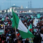 Nigeria at 65: a long road to economic freedom Nigeria flag_protests