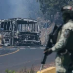 Violent aftermath of Mexico’s ‘El Mencho’ killing follows pattern of other high-profile cartel hits Mexico_soldier_charred vehicle_Michoacan state