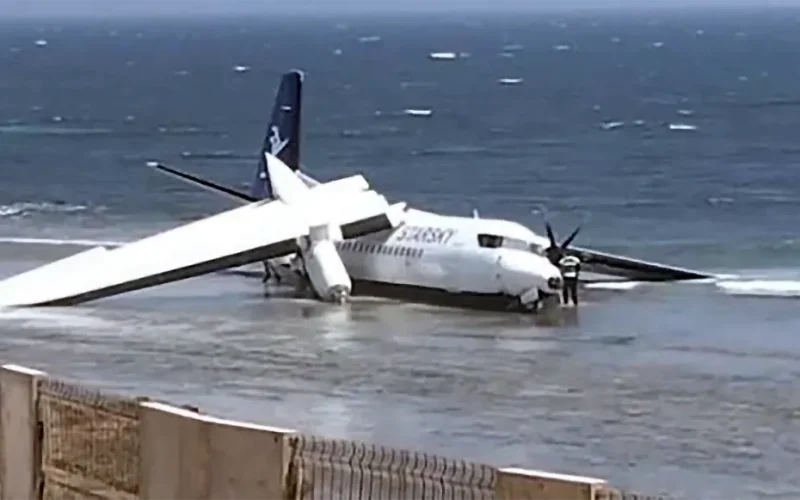 All 55 survive dramatic runway overrun at Mogadishu airport as plane plunges over cliff