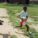 New rugby rules for South African kids aim to keep them safe: what does the research say? young kids playing rugby