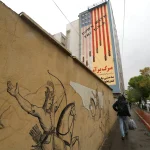 US and Iran: A brief history of how decades of mistrust and bad blood led to open warfare anti-US mural in Tehran