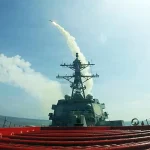 Can the nearly $1 trillion‑a‑year US military really be depleting key weapons in Iran? guided-missile destroyer USS Frank E Petersen Jr
