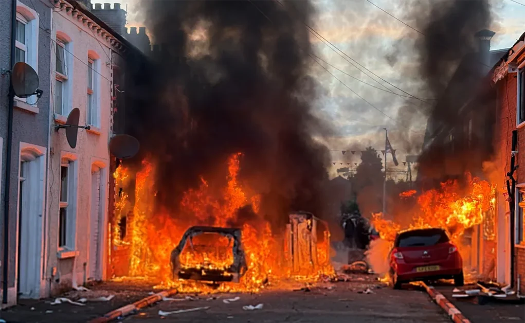 A KNIFE IN THE NECK OF BRITAIN: How one attack in Belfast ignited the UK’s most explosive immigration crisis in years