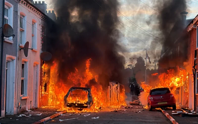 A KNIFE IN THE NECK OF BRITAIN: How one attack in Belfast ignited the UK’s most explosive immigration crisis in years
