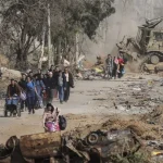 “Nowhere is safe”: UN accuses Israel of war crimes as Gaza death toll surges nine months into ceasefire Gaza_displaced people walking